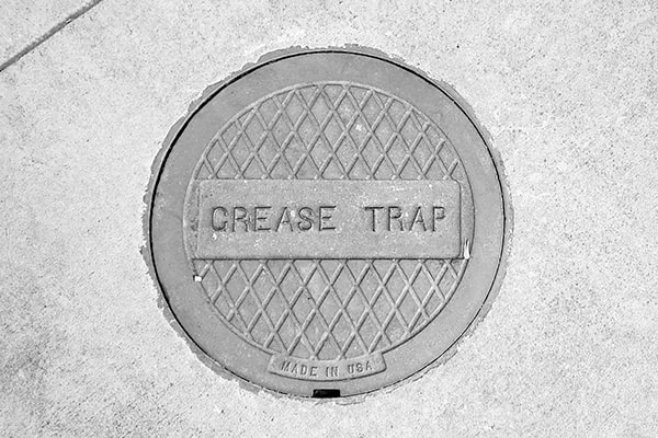 regular inspection and scraping of the trap's interior can help minimize the frequency of grease trap pumping